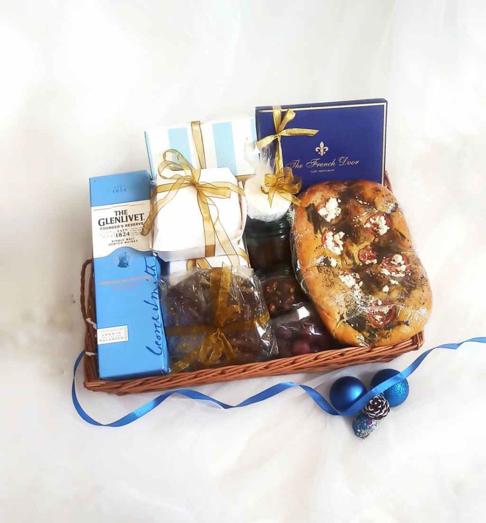 Rectangular tray with Assorted confections, perfumes and wrapped gifts